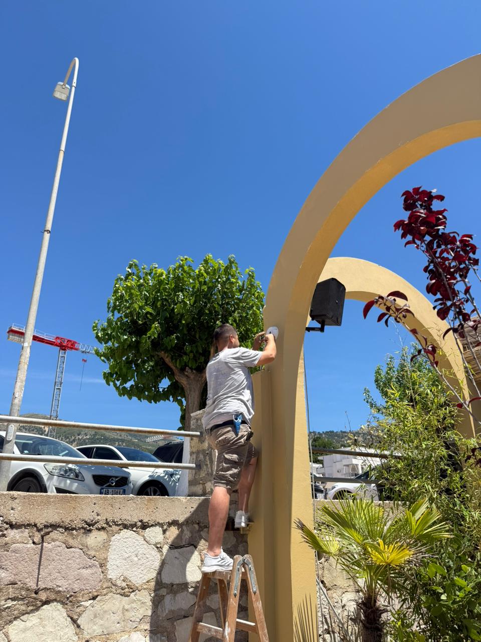 Technician installing a security camera