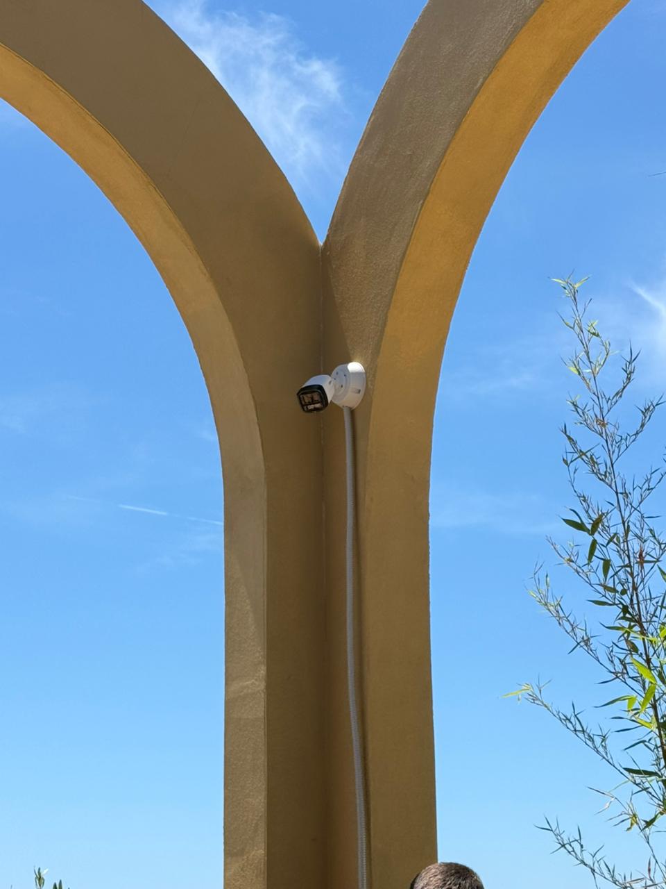 Solvex camera installation on an outdoor arch